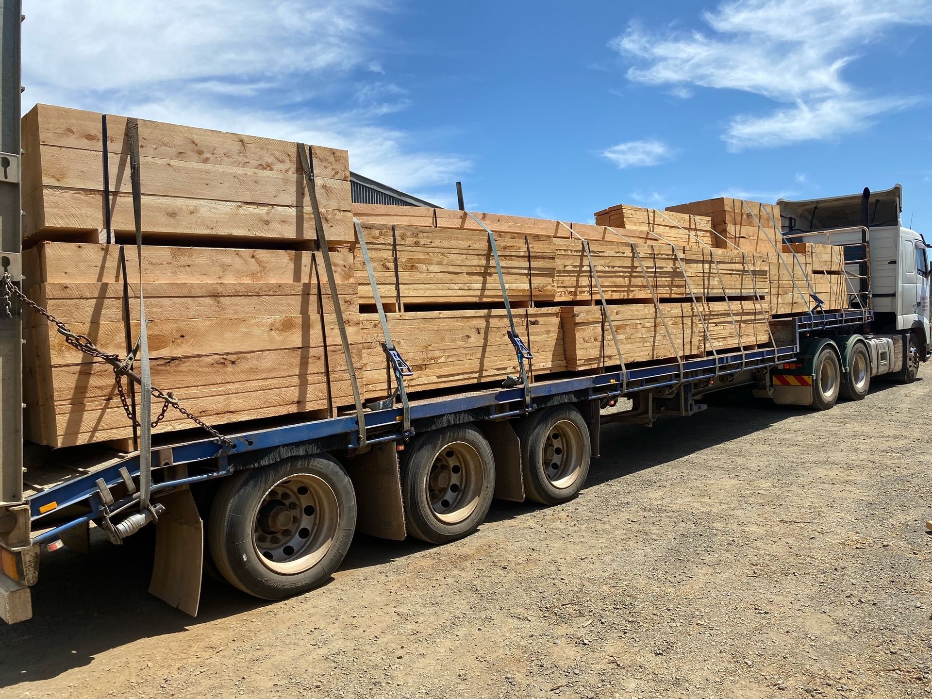 a professional cutting a wooden log