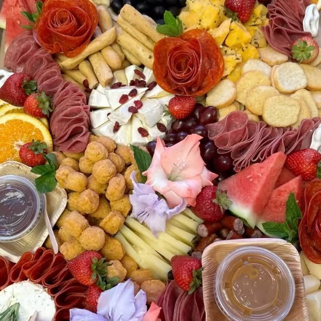 A variety of fruits and vegetables are displayed on a table