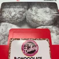A box of chocolate donuts from cp bakery.