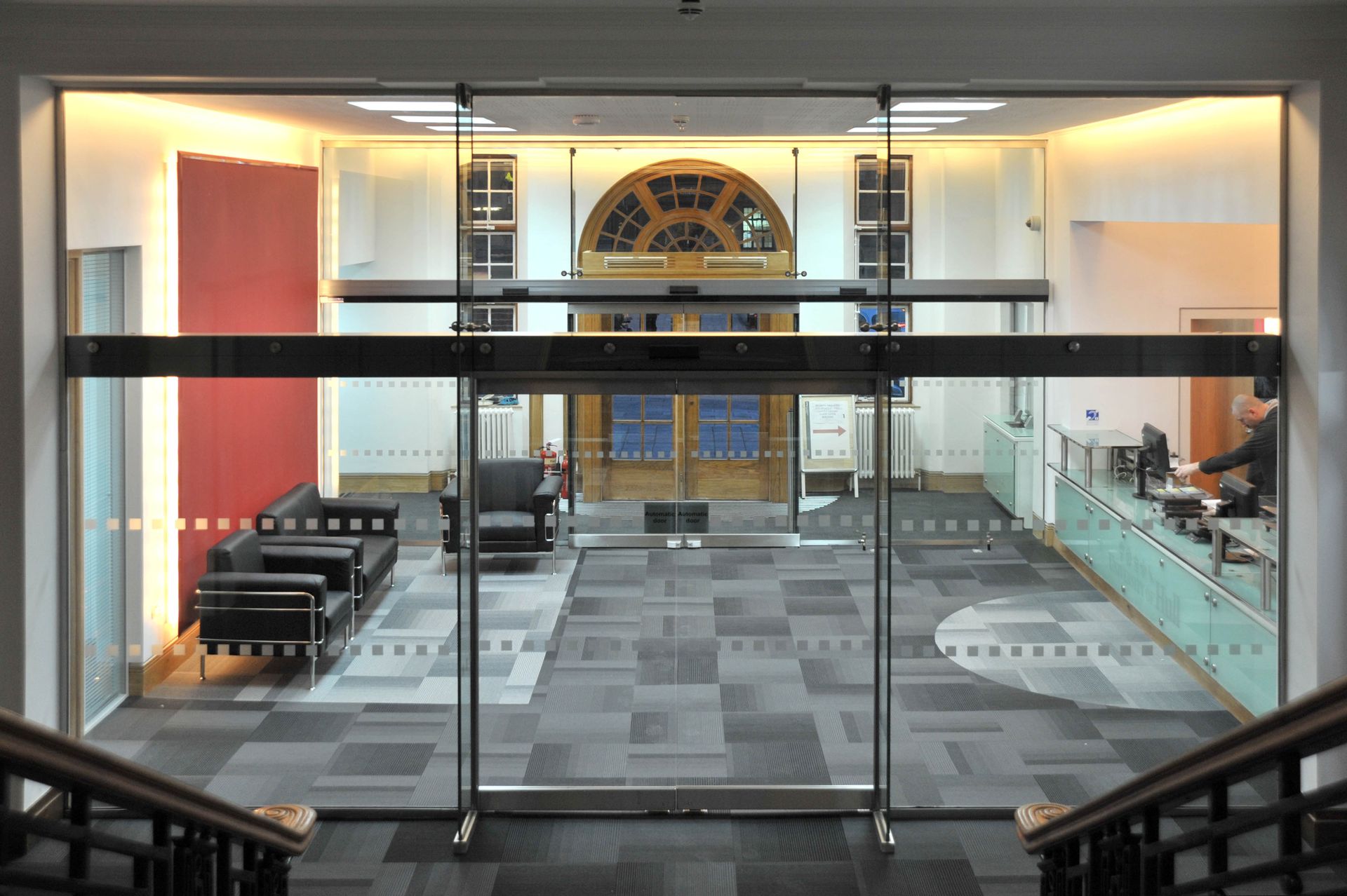 automatic sliding glass doors hung on glass