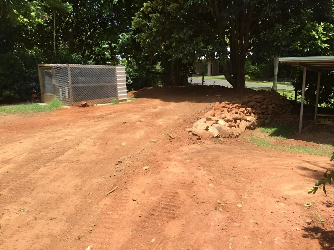 A Dirt Road with A Fence and Trees in The Background — J Newton Excavations in Bentley Park, QLD