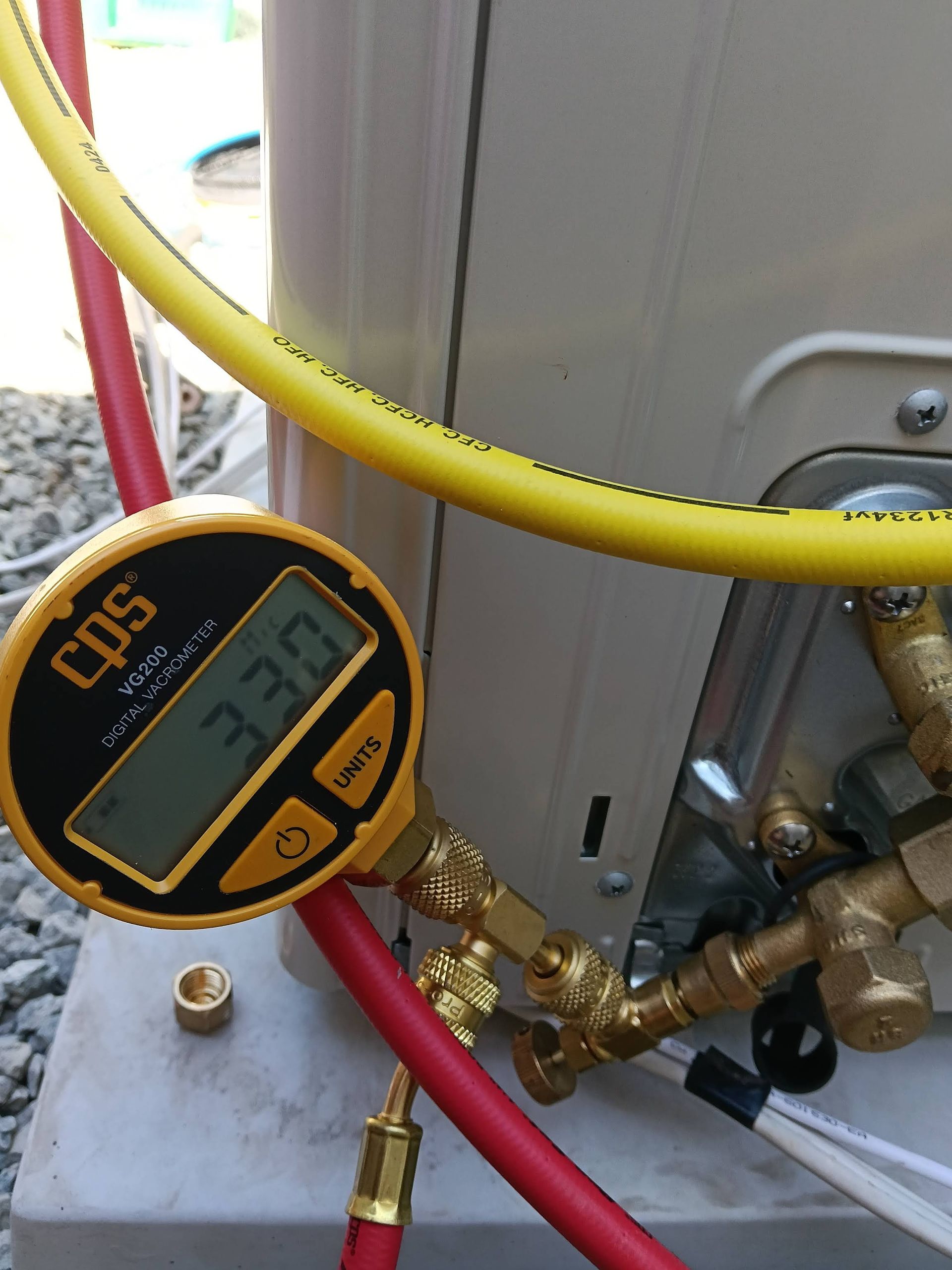 Yellow and Red Hoses Connected to a Gauge Displaying 330 — DC Active Electrical in Brighton, QLD