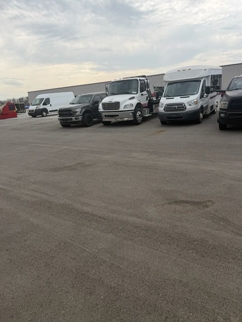 A flatbed tow truck loading a vehicle for safe transport.