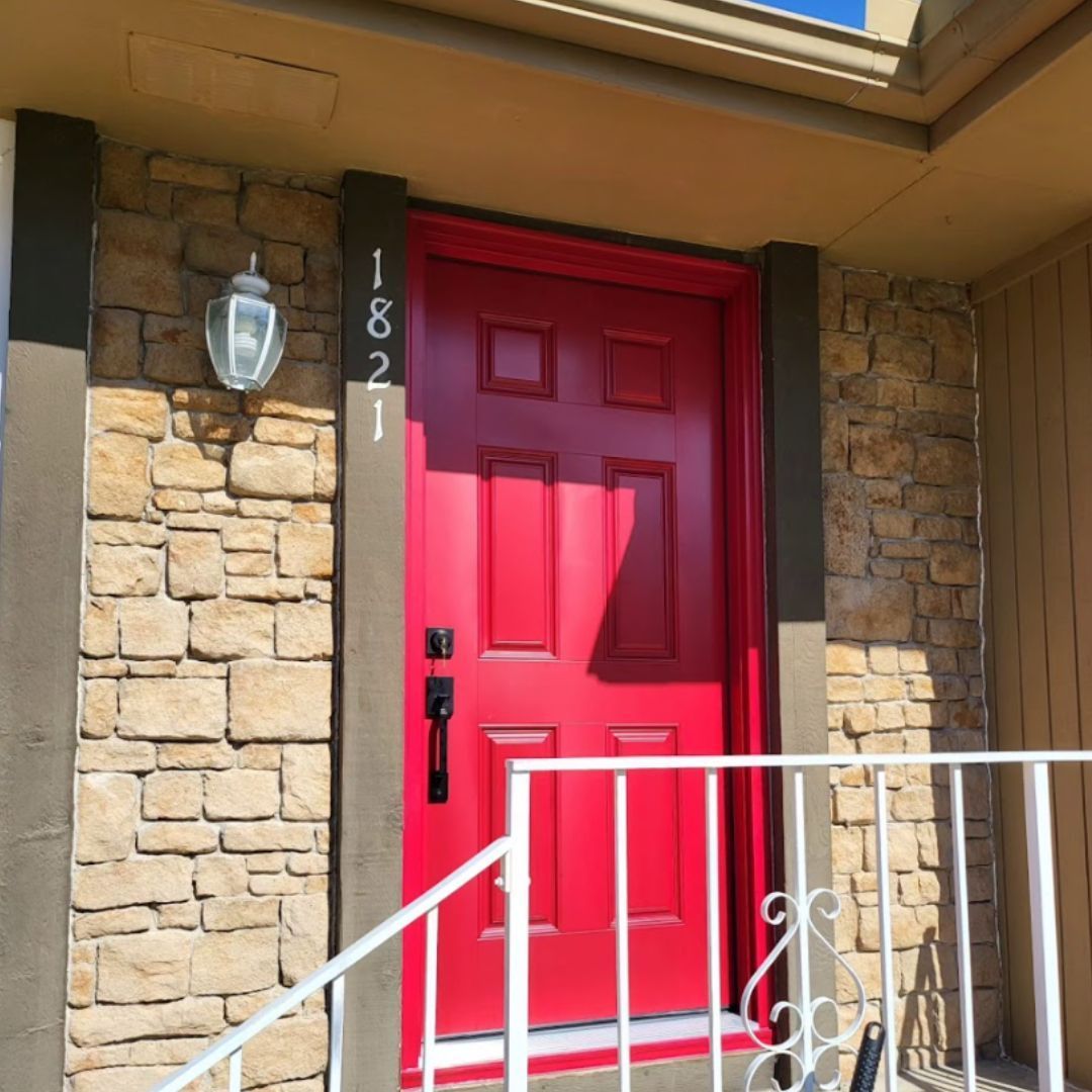 A red door with the number 1821 on it