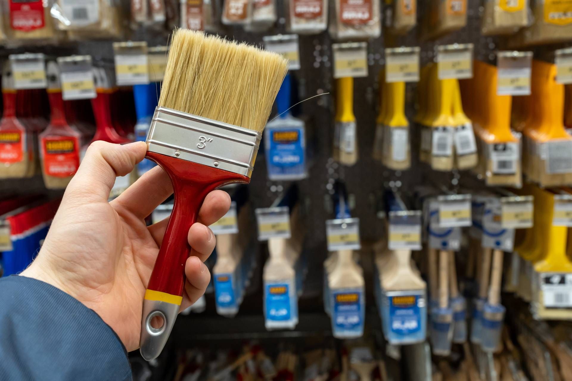 A professional painter buying tools at a professional paint center near the Caribbean