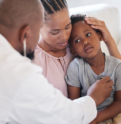 Child getting examined by doctor