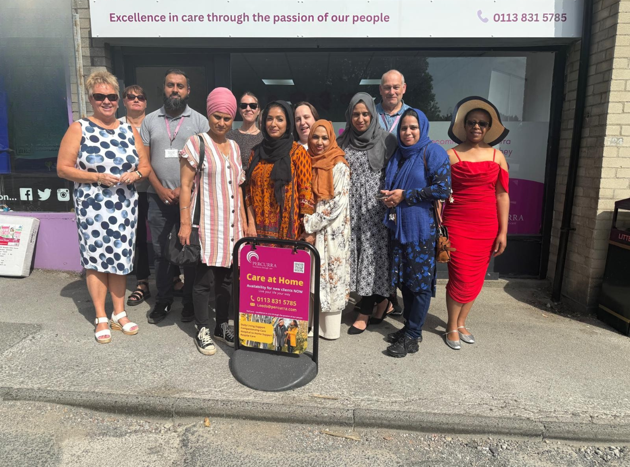 a group of people outside an office building