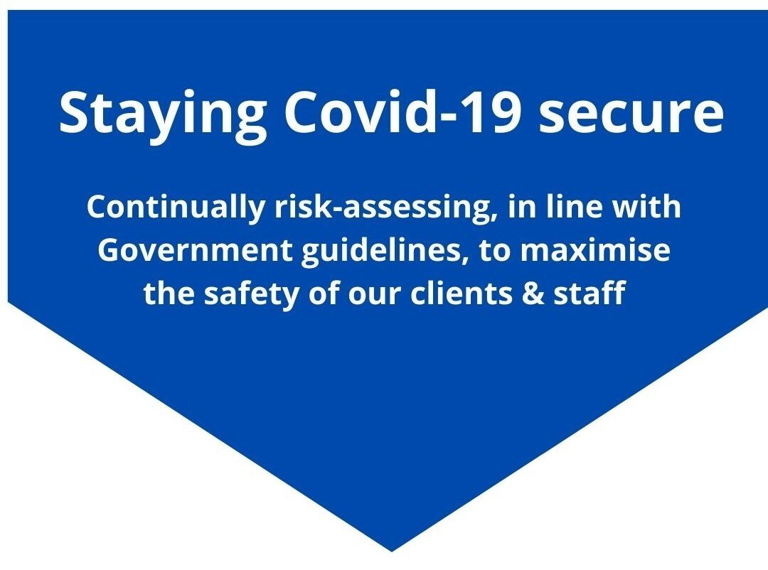 a blue sign that says staying covid-19 secure
