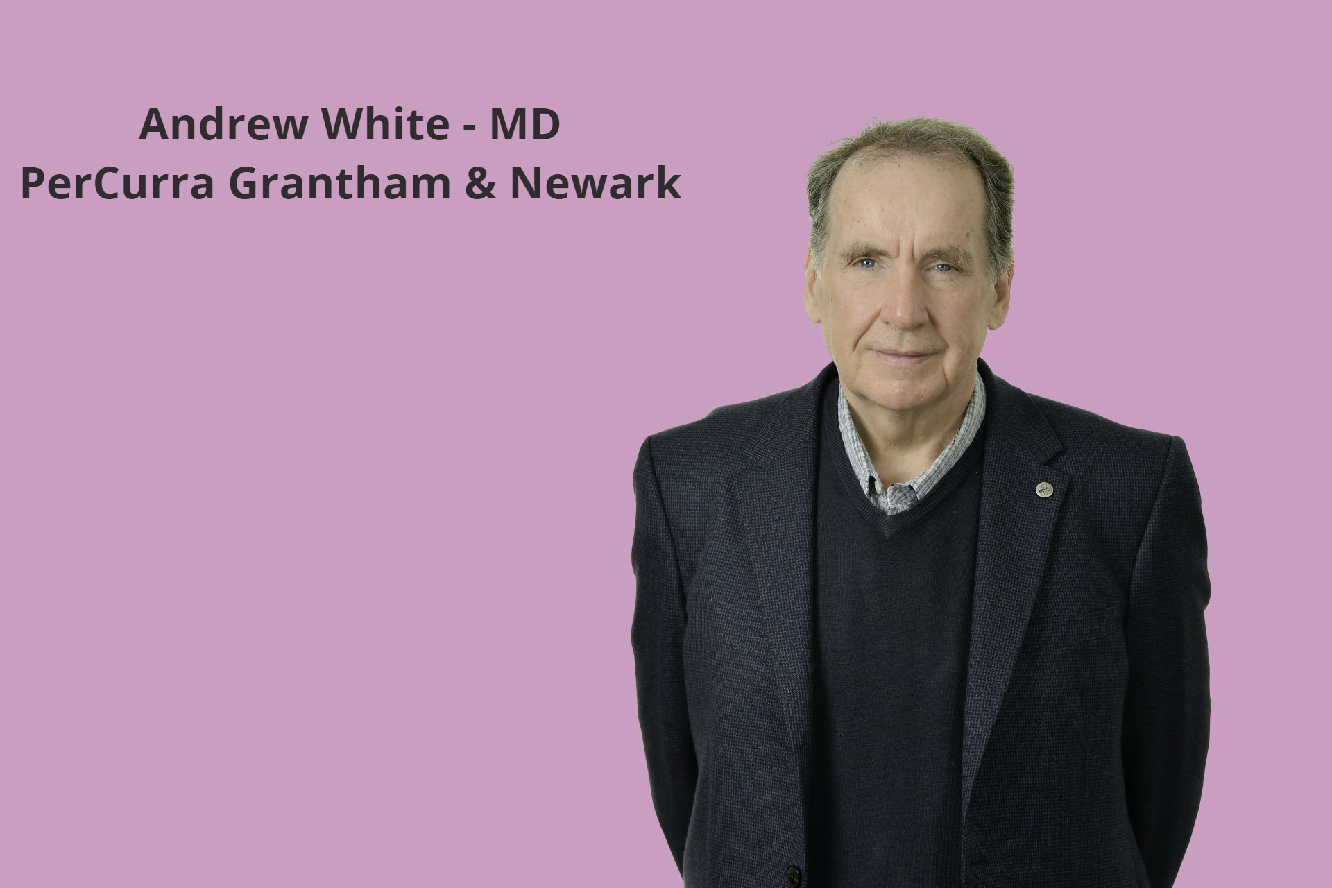 a man in a suit stands in front of a pink background that says andrew white md
