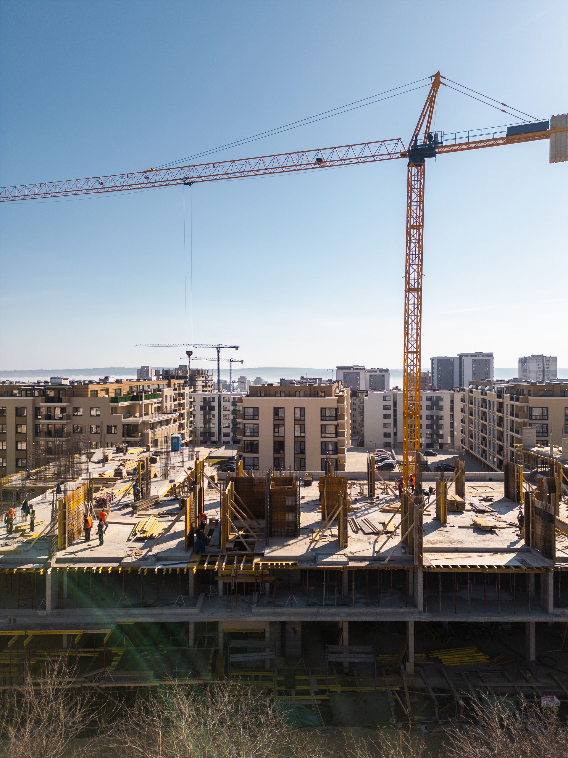 Construction site with a yellow crane.