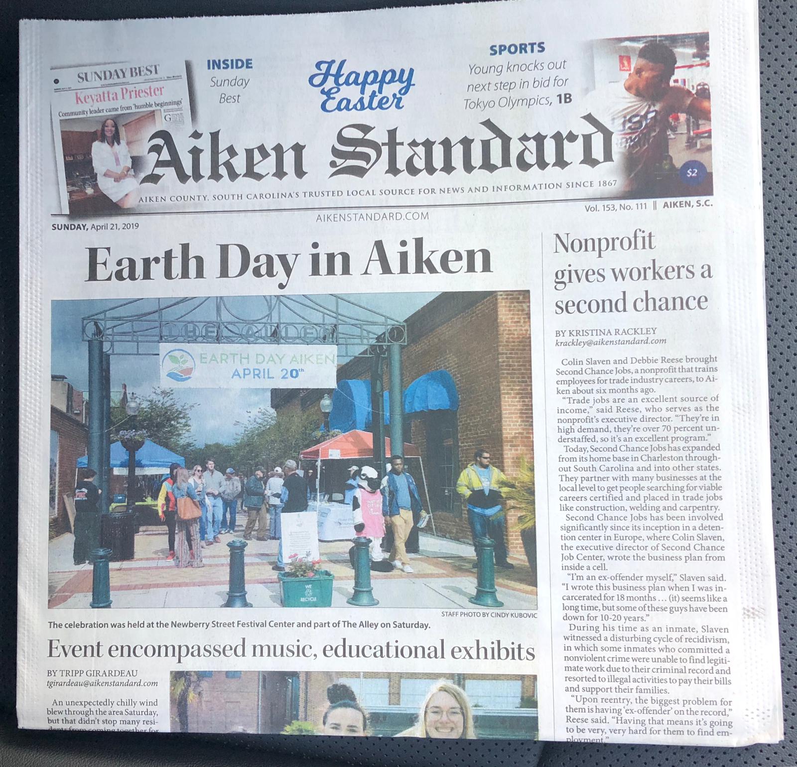 A newspaper that says ' aiken standard ' on it