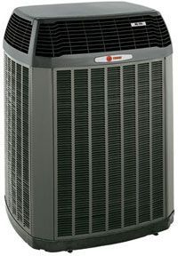 A large air conditioner is sitting on a white surface.