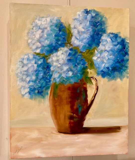 A painting of blue flowers in a vase on a table.