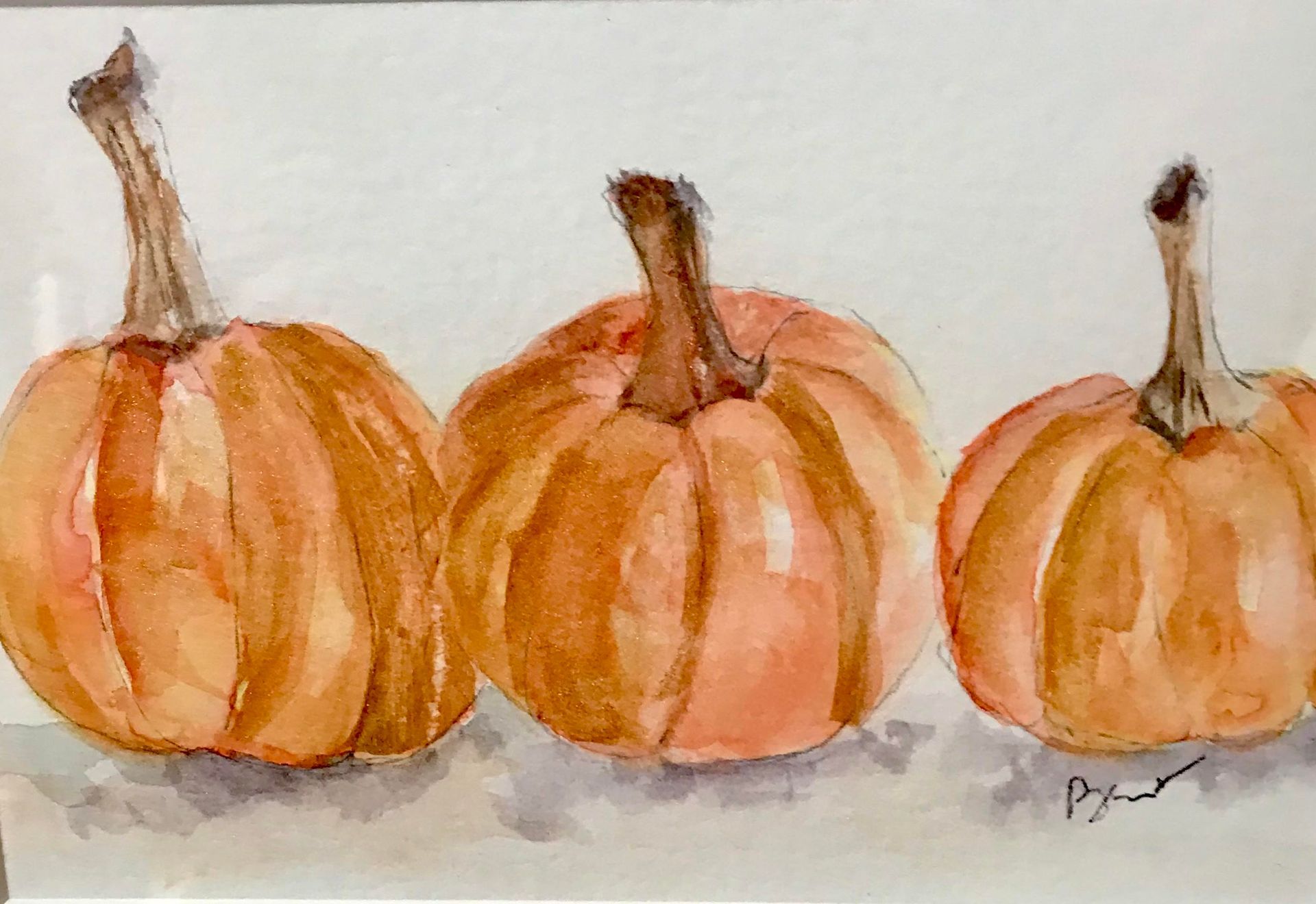 Three pumpkins are lined up in a row in a watercolor painting.