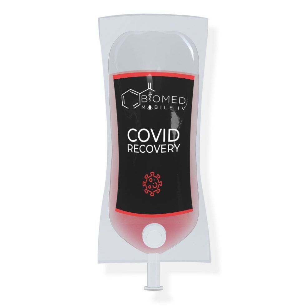 A covid recovery bag with a red liquid in it.