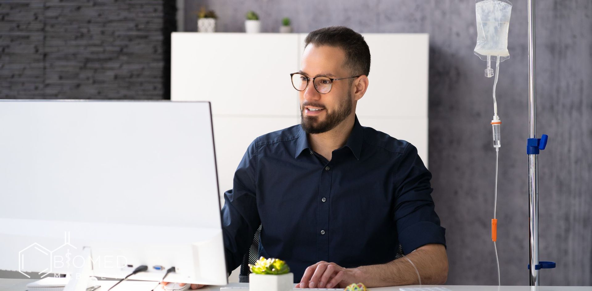 Man working while getting IV