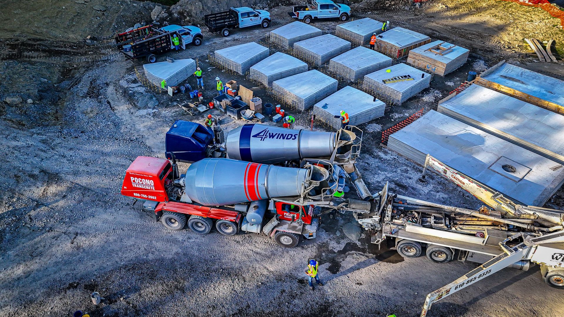 A construction site with a concrete mixer and a pump — Bethlehem, PA — 4 Winds Concrete Inc