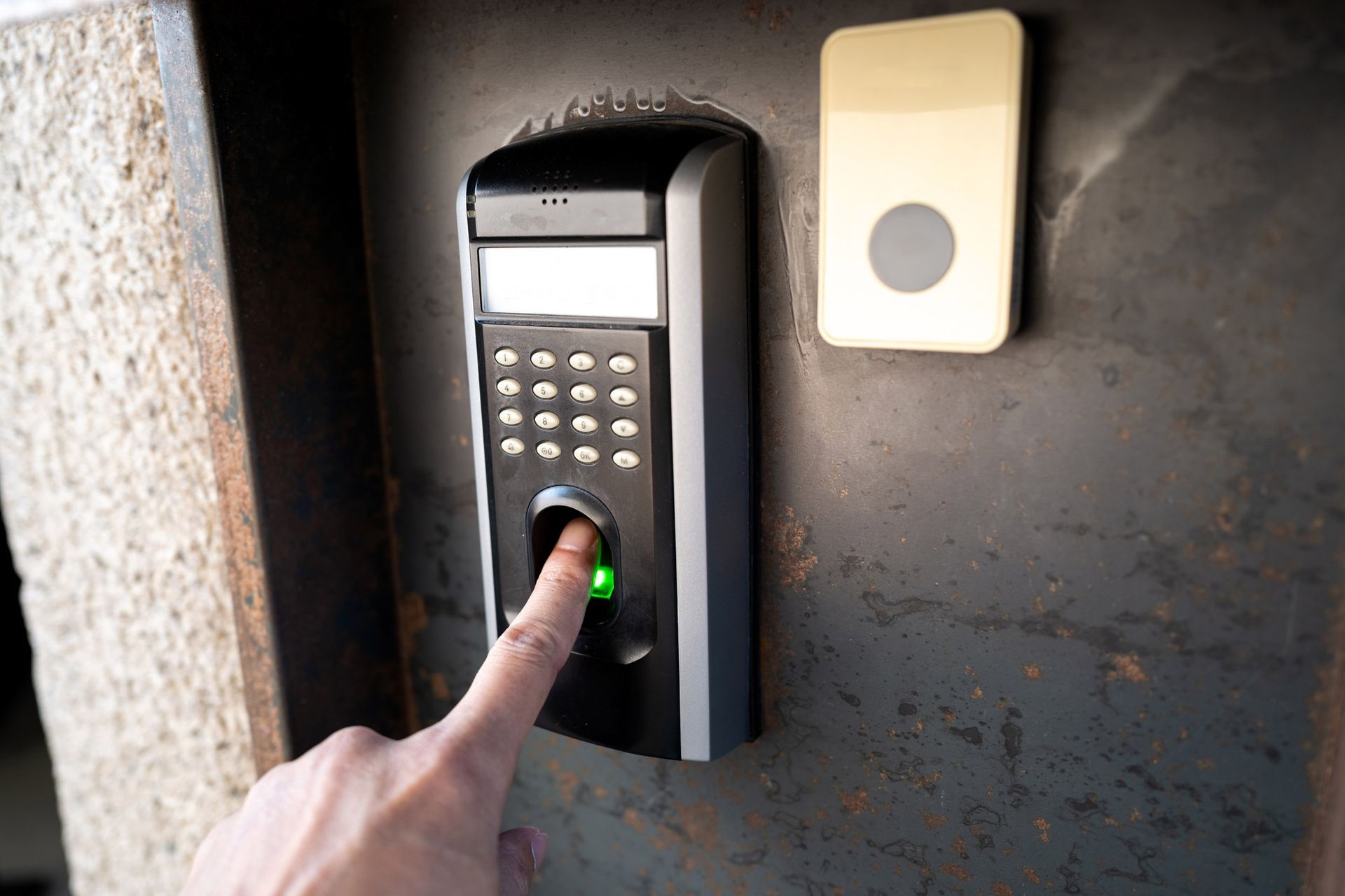 Fingerprint scanner for electronic access systems installed on a door, ideal for businesses in Aubur