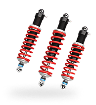 Three red and black motorcycle shock absorbers. | Michael's Auto Service