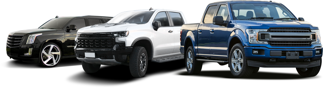 Three vehicles: black SUV, white pickup truck, and blue pickup truck, aligned and angled to the right. | Michael's Auto Service