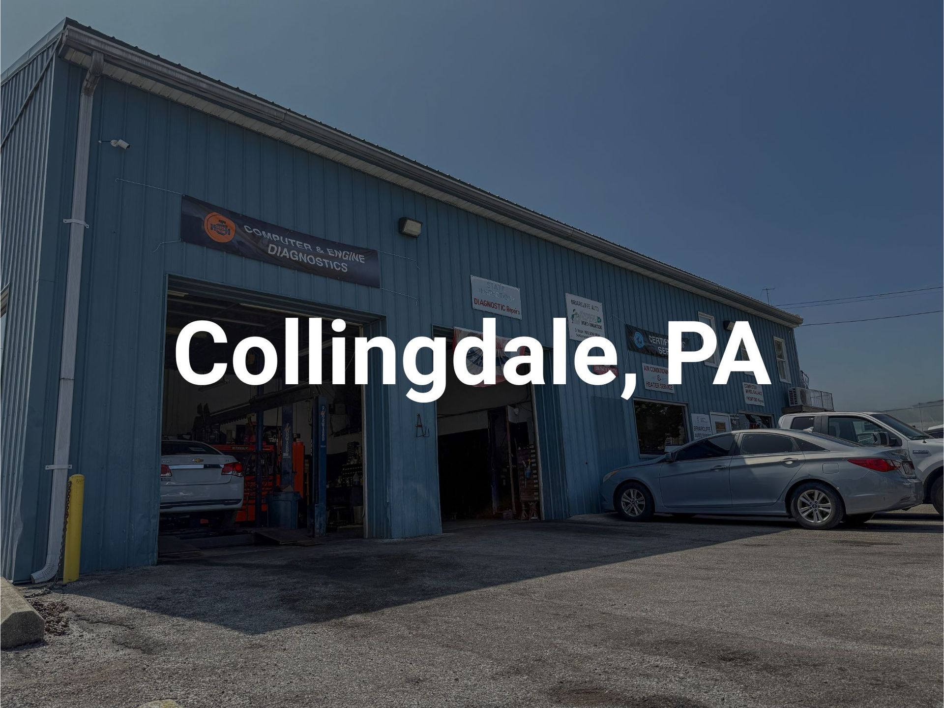 Briarcliffe Auto Service's auto repair shop in Briarcliffe, PA, with open bay doors and parked cars.