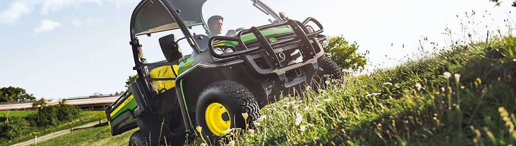 Deere technician working on a machine