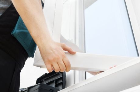 Man Installing Window — Mechanicsville, VA — American Gutter Service