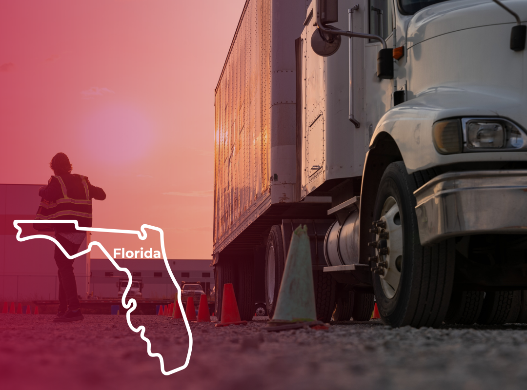 A person in a high-visibility safety vest walks across a gravel lot beside a white semi-truck at sunset in Florida, with orange and green traffic cones marking a CDL driver training course.