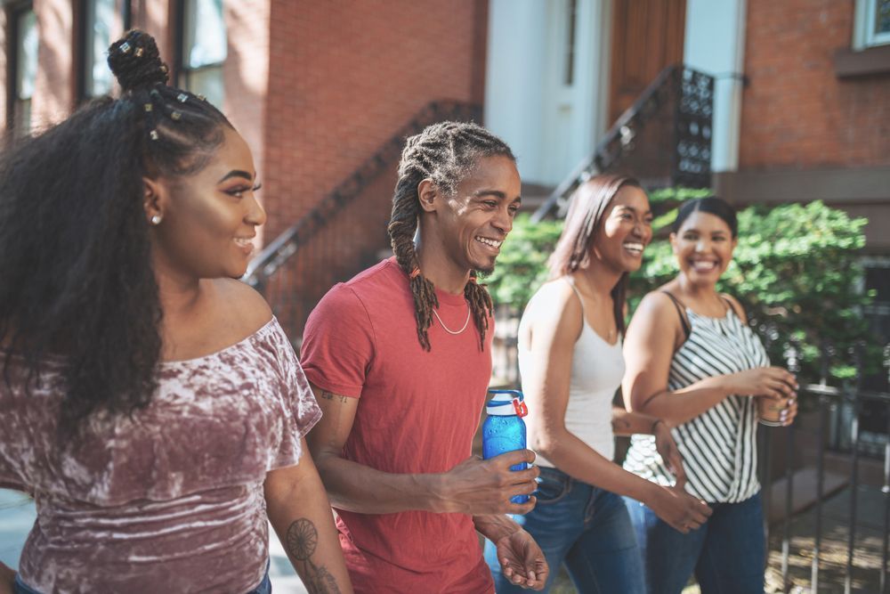 People Smiling On The Street — St. Louis, MO — NAACP St. Louis County