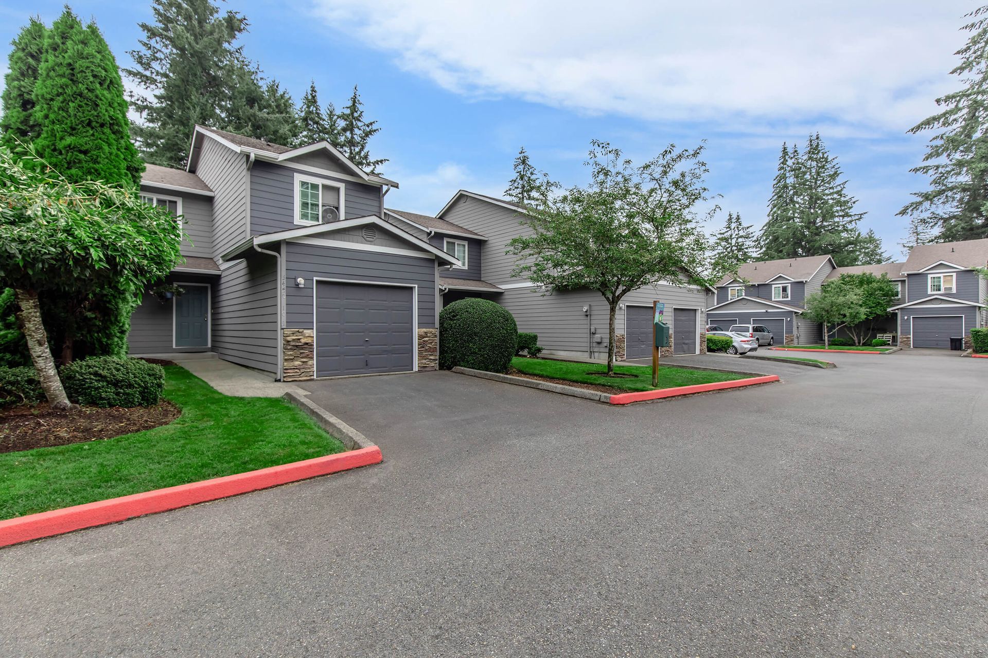 A row of houses with garages in a residential area