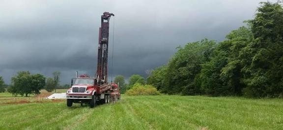 Men Standing Near Truck — Nixa, MO — Hewitt-Well Drilling & Pump Service