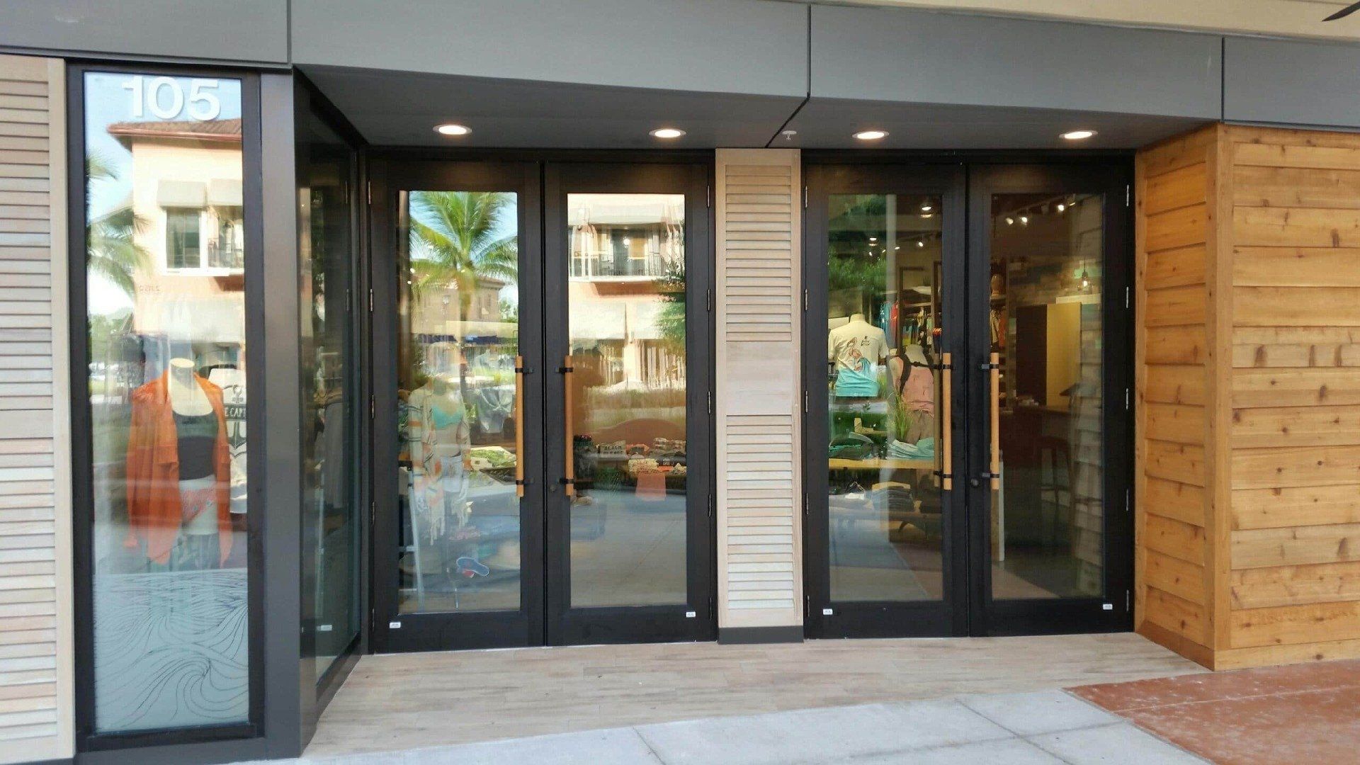 Storefront with glass doors and wood paneling. Building number 109 is visible.