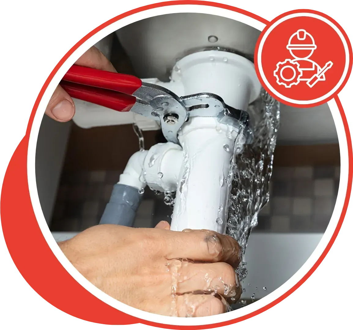 Person using a wrench to fix a leaky sink drain, with water spraying.