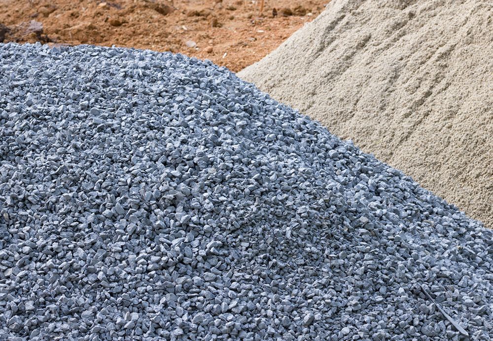A pile of gravel and sand on a construction site.