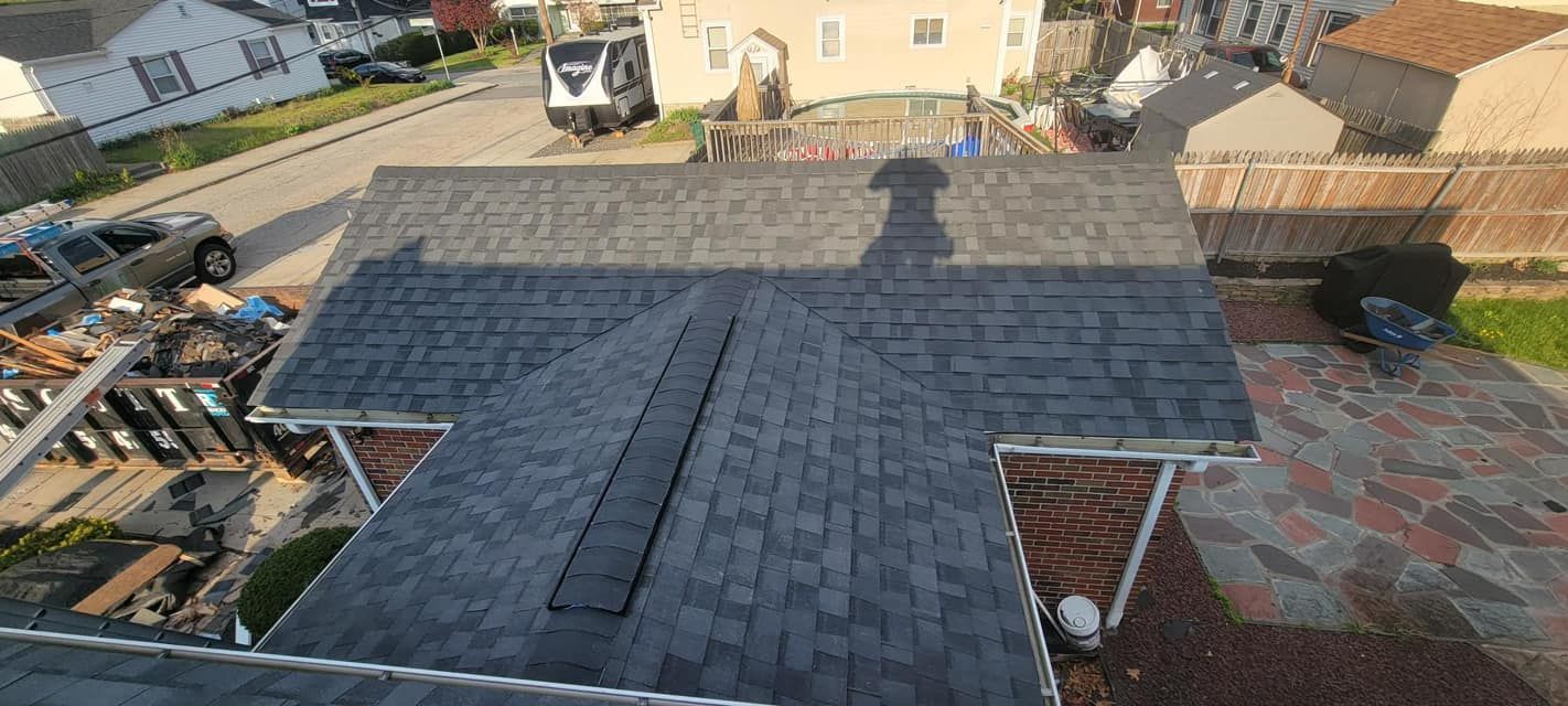 An aerial view of a roof being installed on a house.
