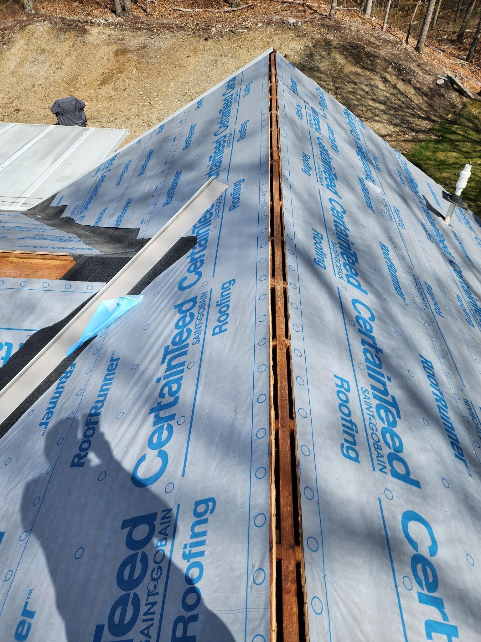 A roof with a lot of roofing material on it