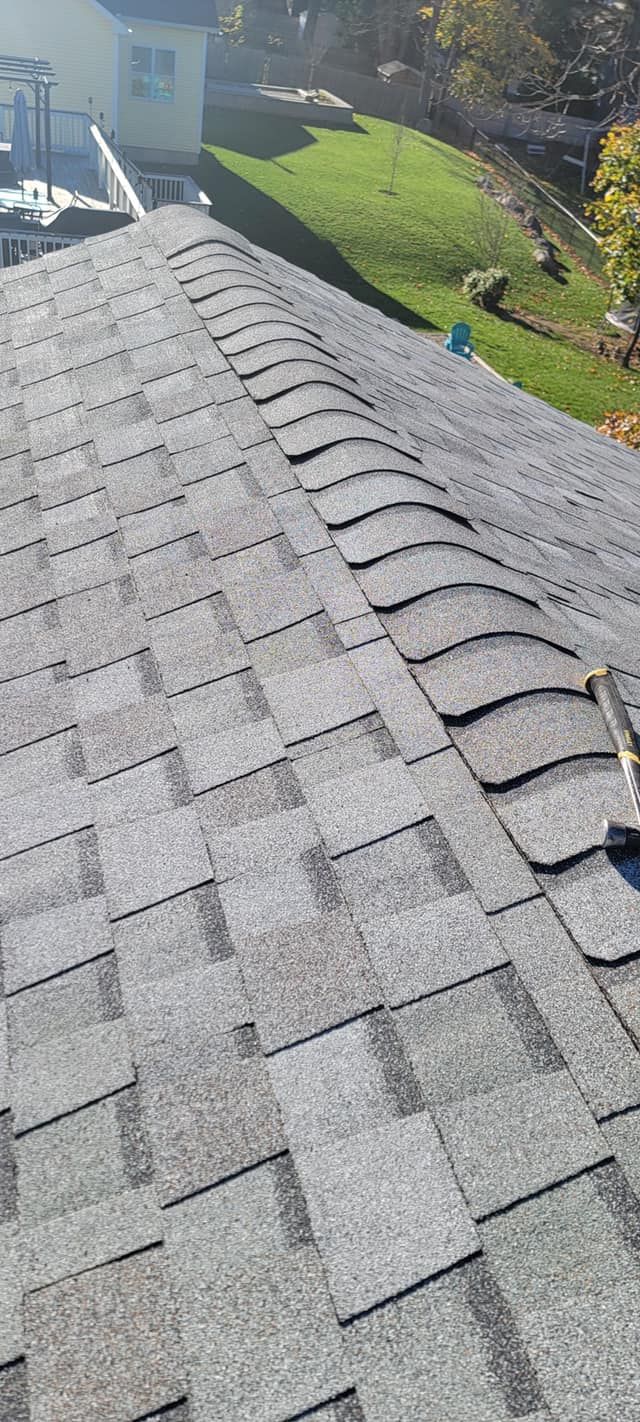 A close up of a roof with shingles on it.