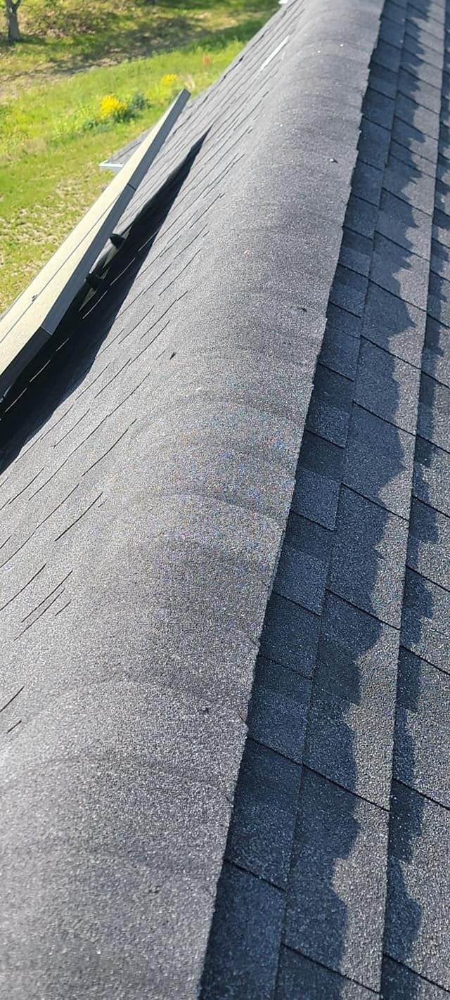 A close up of a roof with shingles on it.