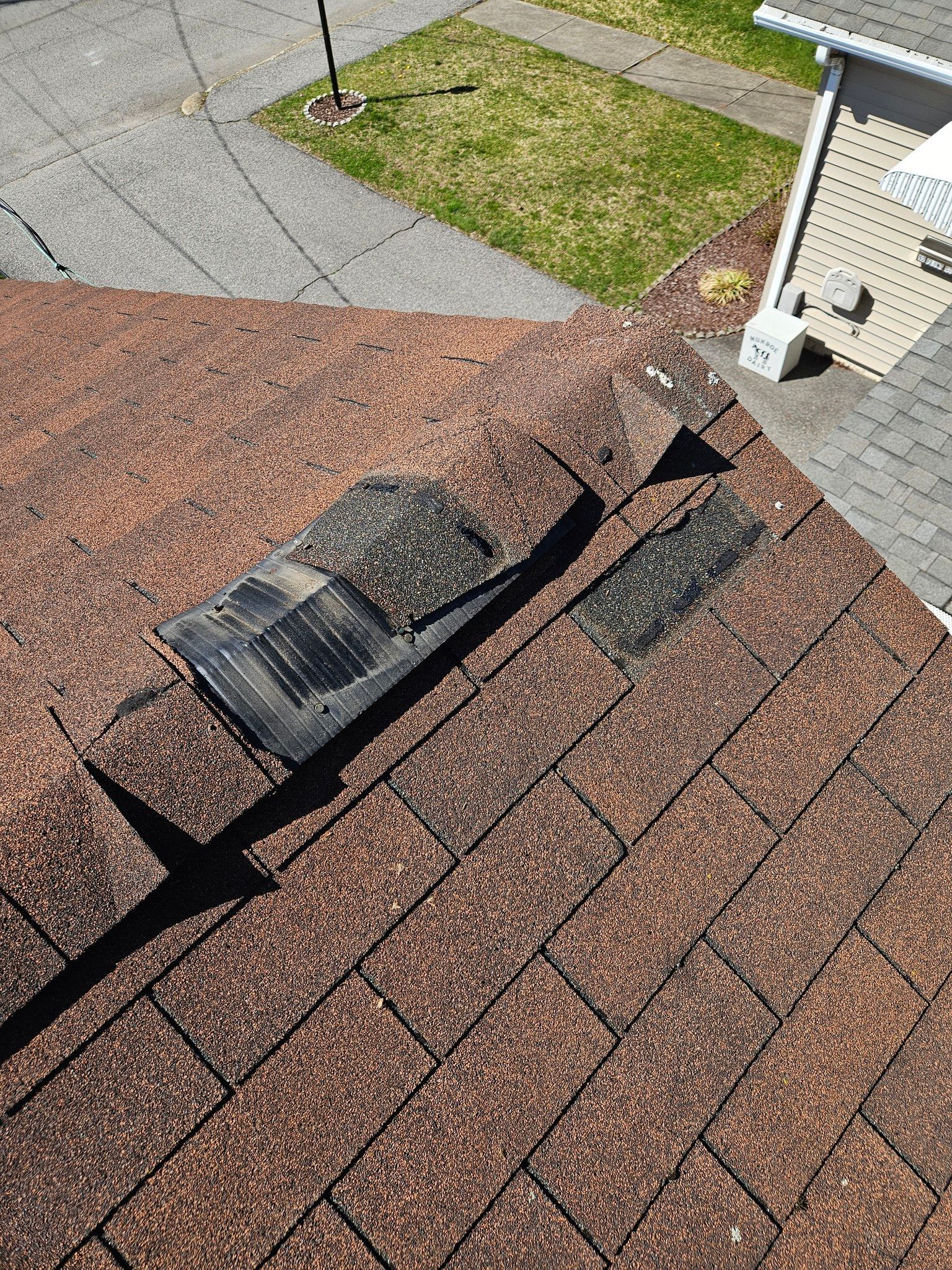 A close up of a roof with a hole in it.