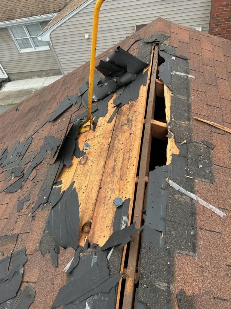 A roof with a hole in it that needs to be repaired.