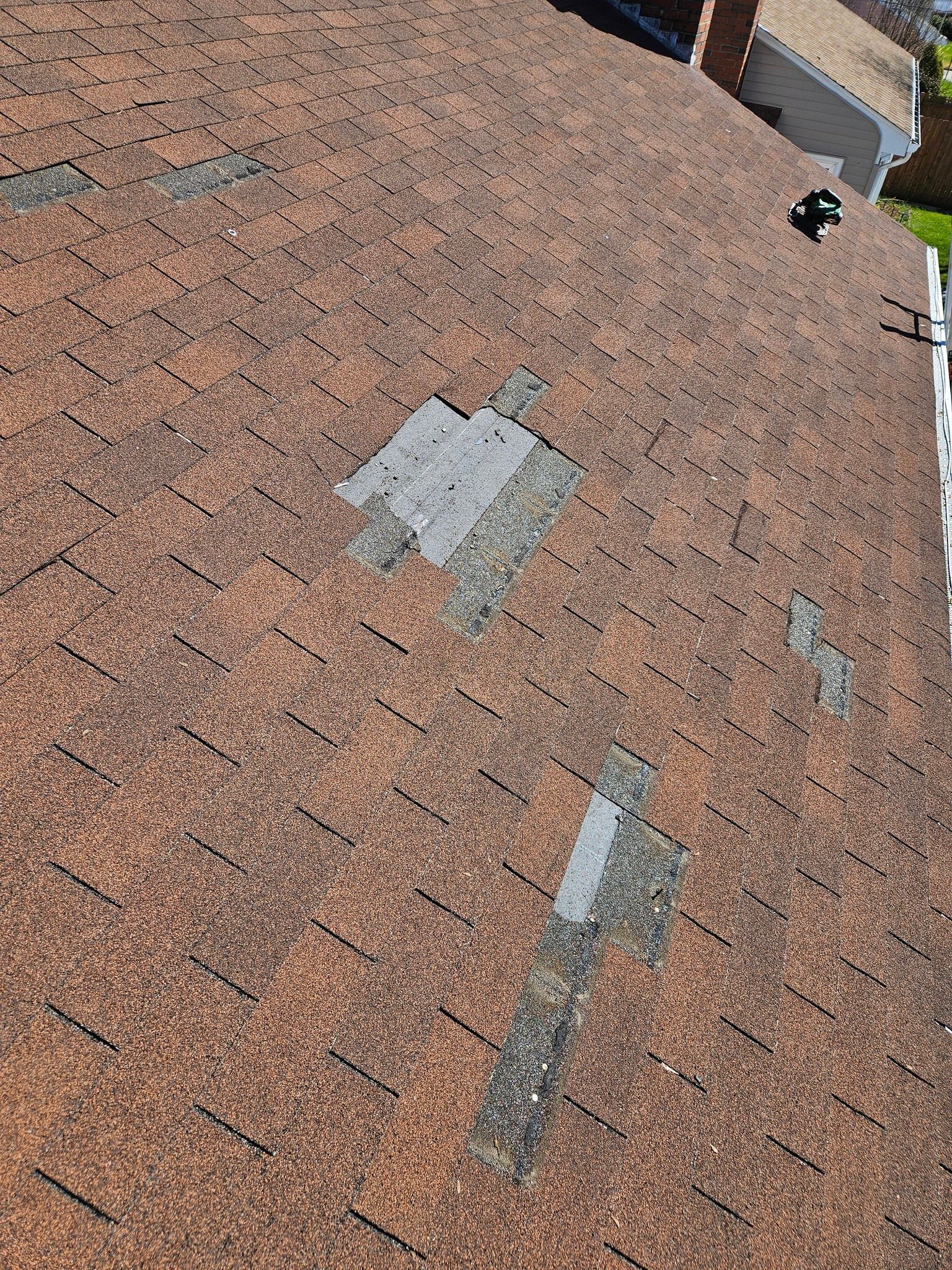 A close up of a roof with a lot of damage on it.