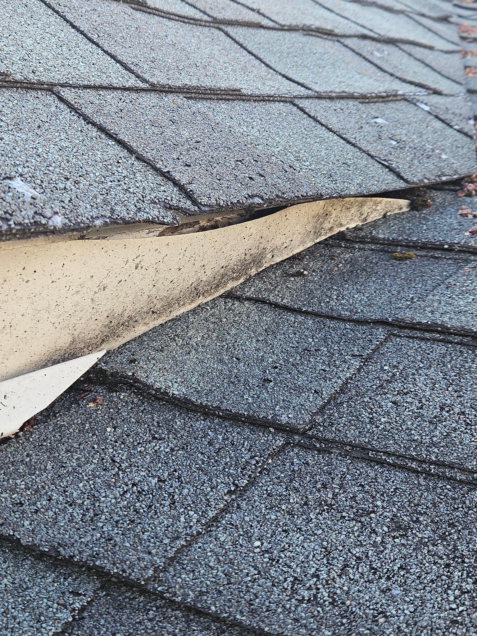 A close up of a roof with a hole in it.