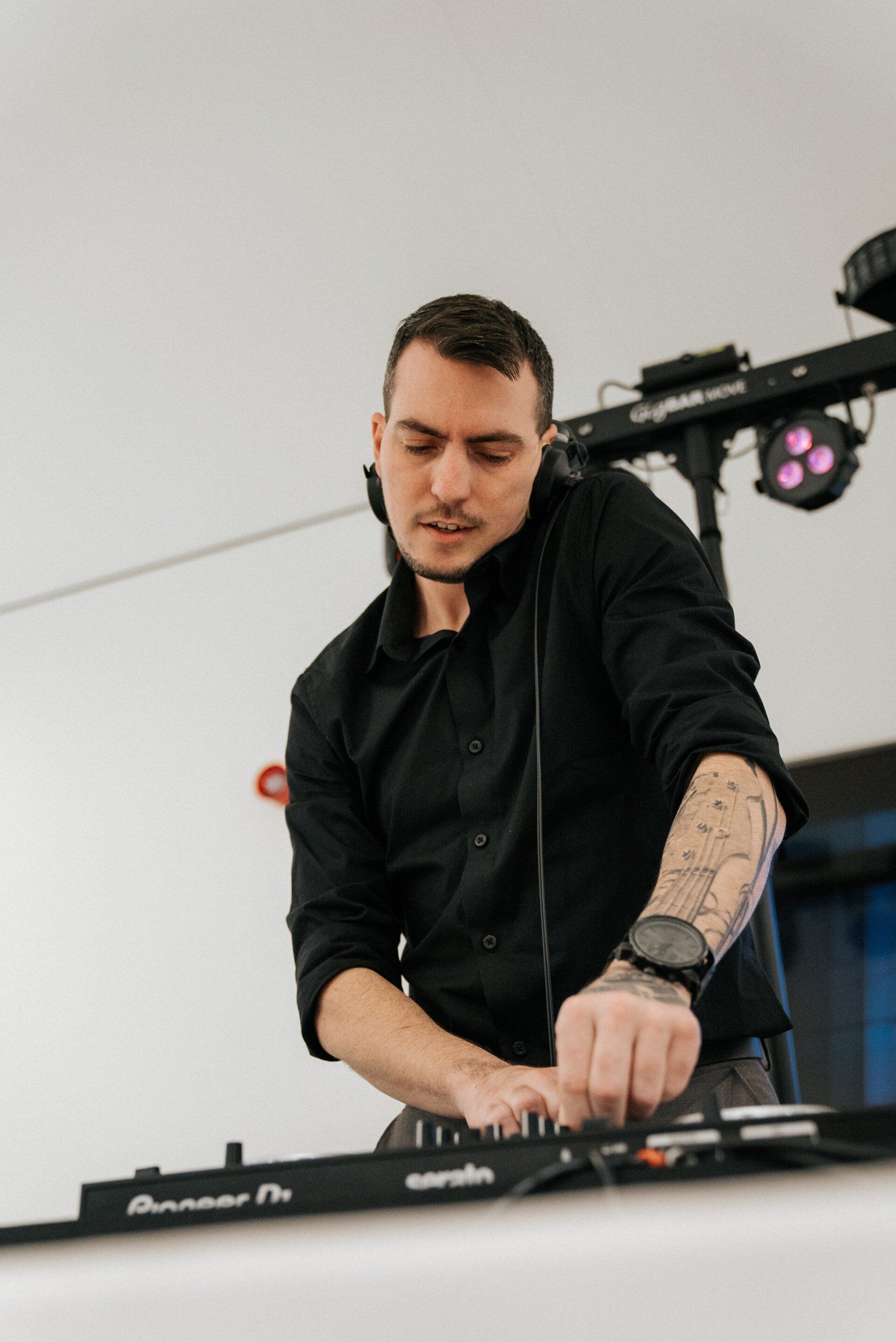 DJ Xander Ale beatmatches the next track before blending it in to the mix