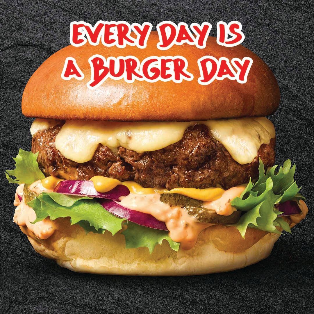 Burger with melted cheese, lettuce, onion, and sauce. Text: Every Day Is A Burger Day.