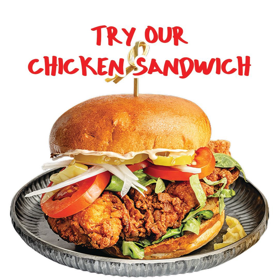 Chicken sandwich on a plate, with text that reads 