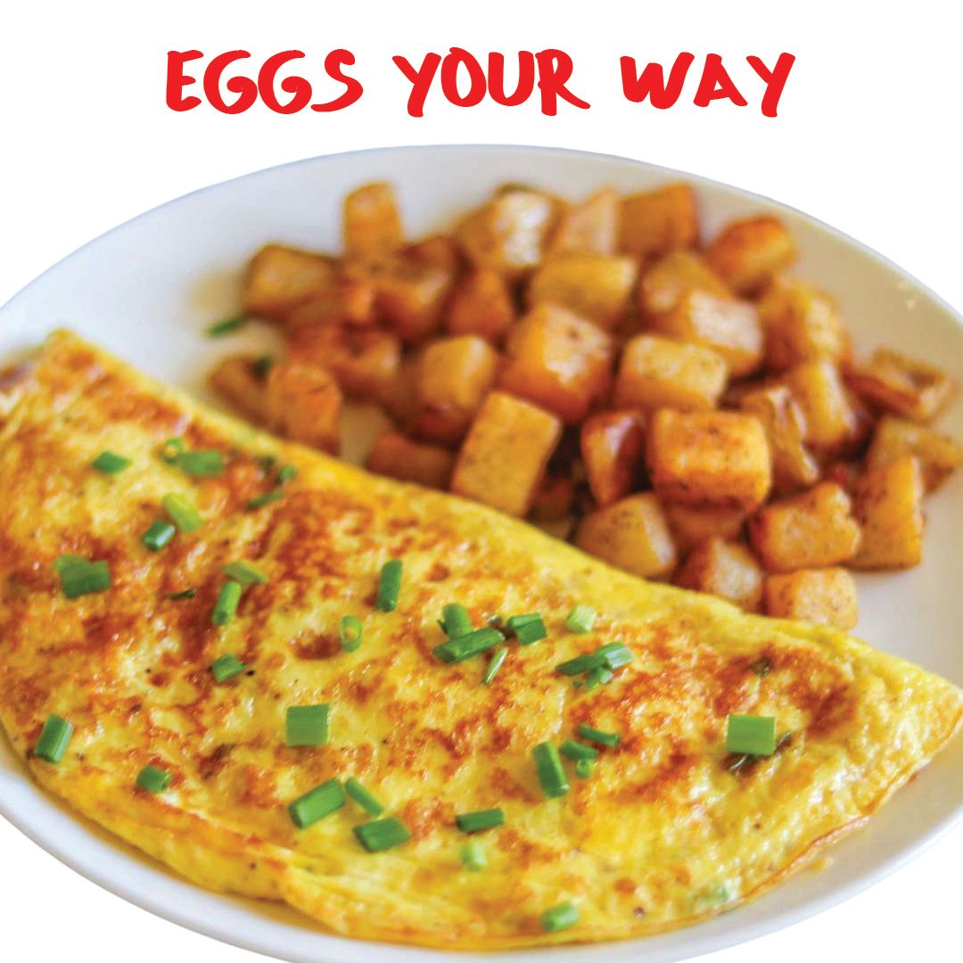 Omelet with chives and diced potatoes on a white plate. 