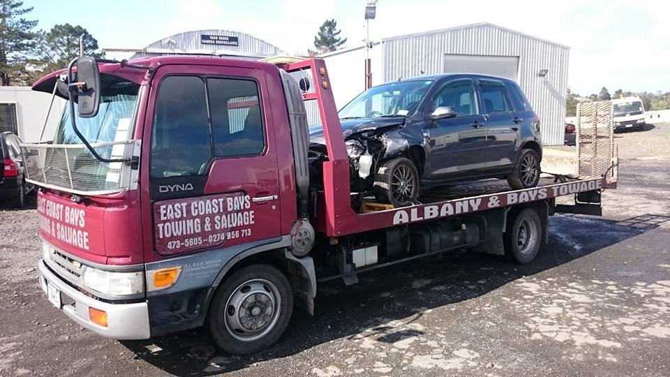 Professionals providing towing services during breakdown