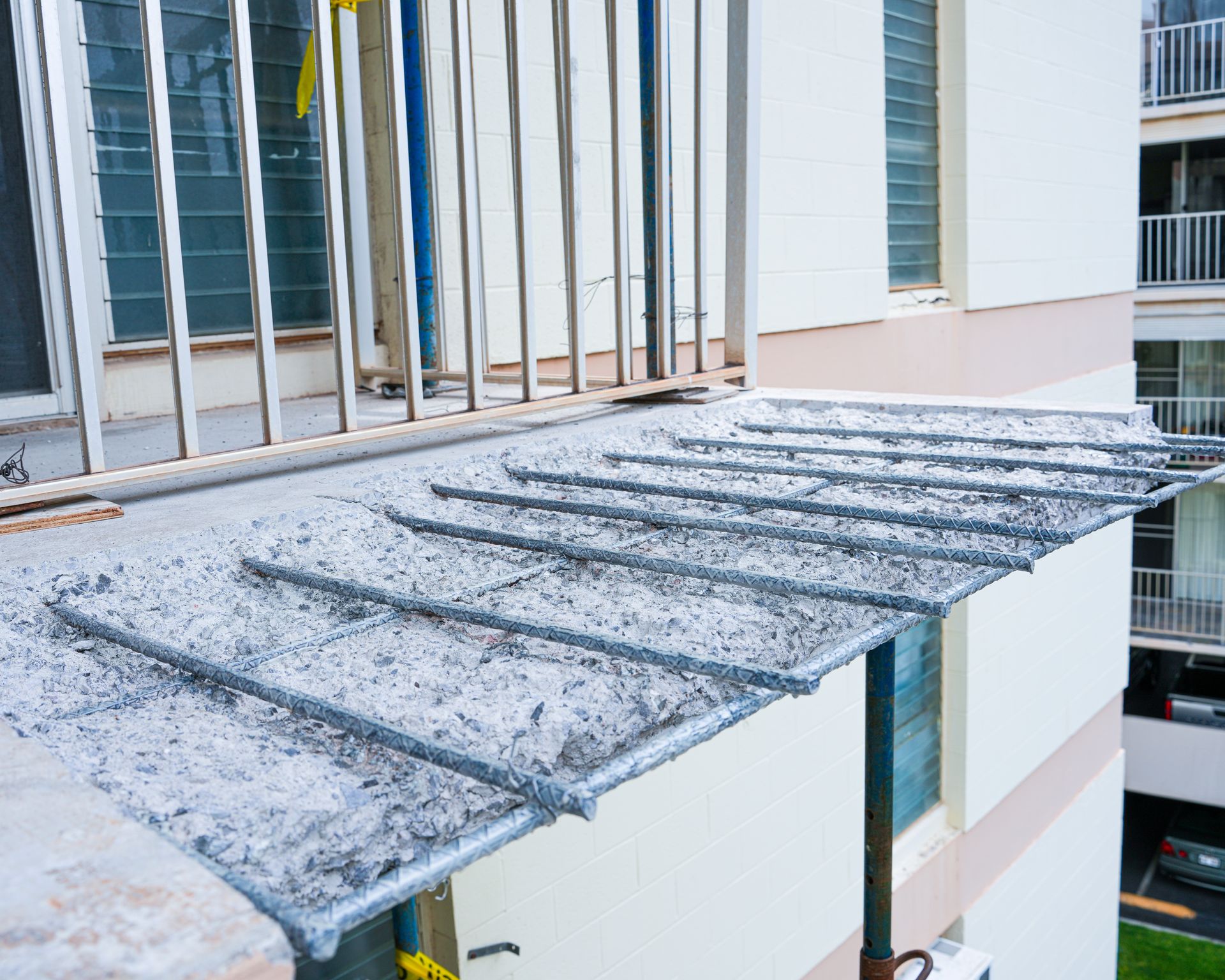 A worker is floating a concrete surface