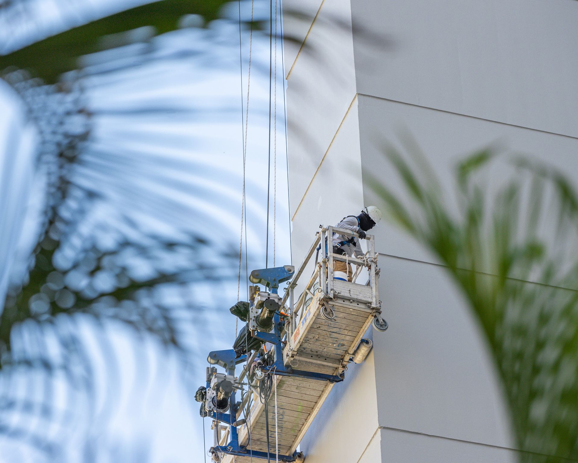 Image of men waterproofing a building showcasing the great service offered by Seal Masters of Hawai'