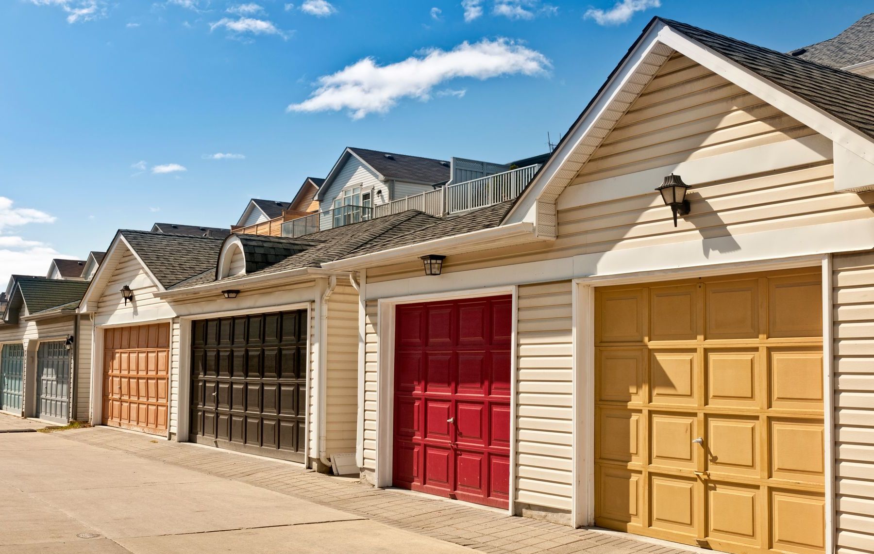 Colored raised panel garage doors.